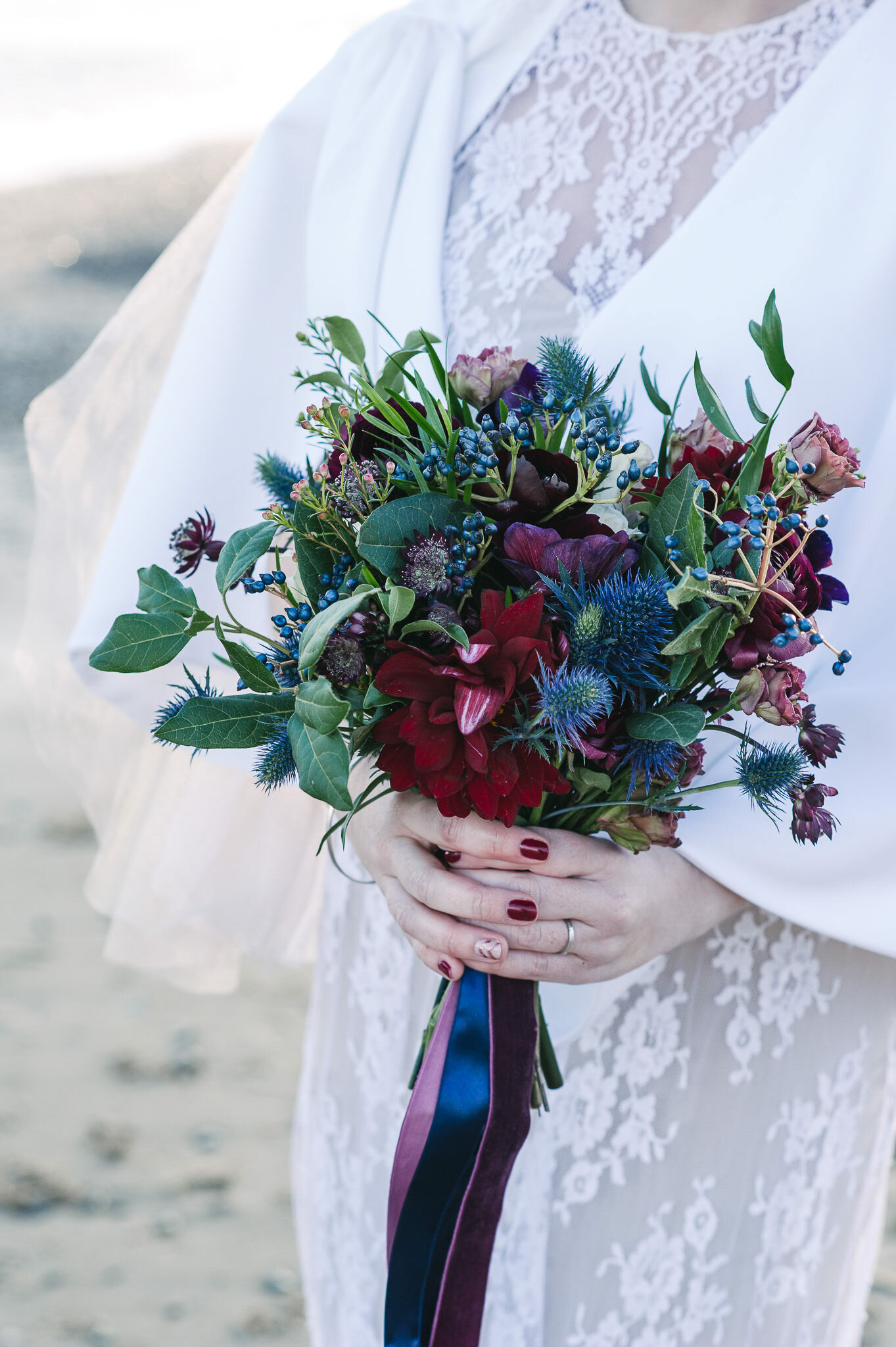 Wedding bouquet with red and blue flowers from local Irish wedding vendor.